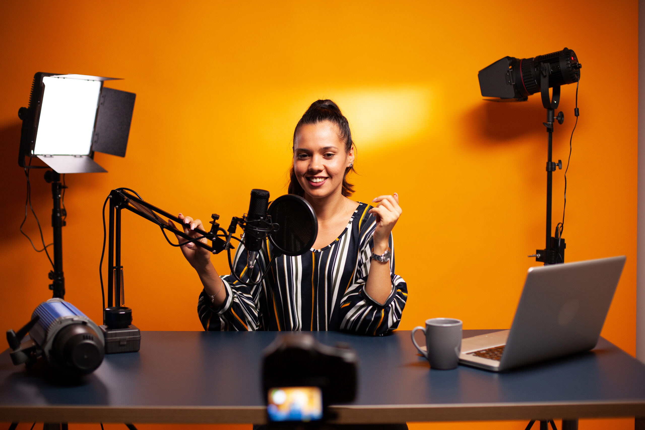 Famous vlogger recording video using professional recording gear. Content creator new media star on social media recording for internet web online subscribers audience new podcast episode.